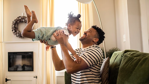 a man holding a baby
