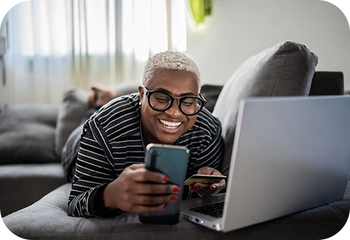 Guy on phone and computer
