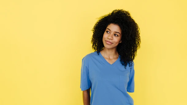 Woman in blue thinking thoughtfully