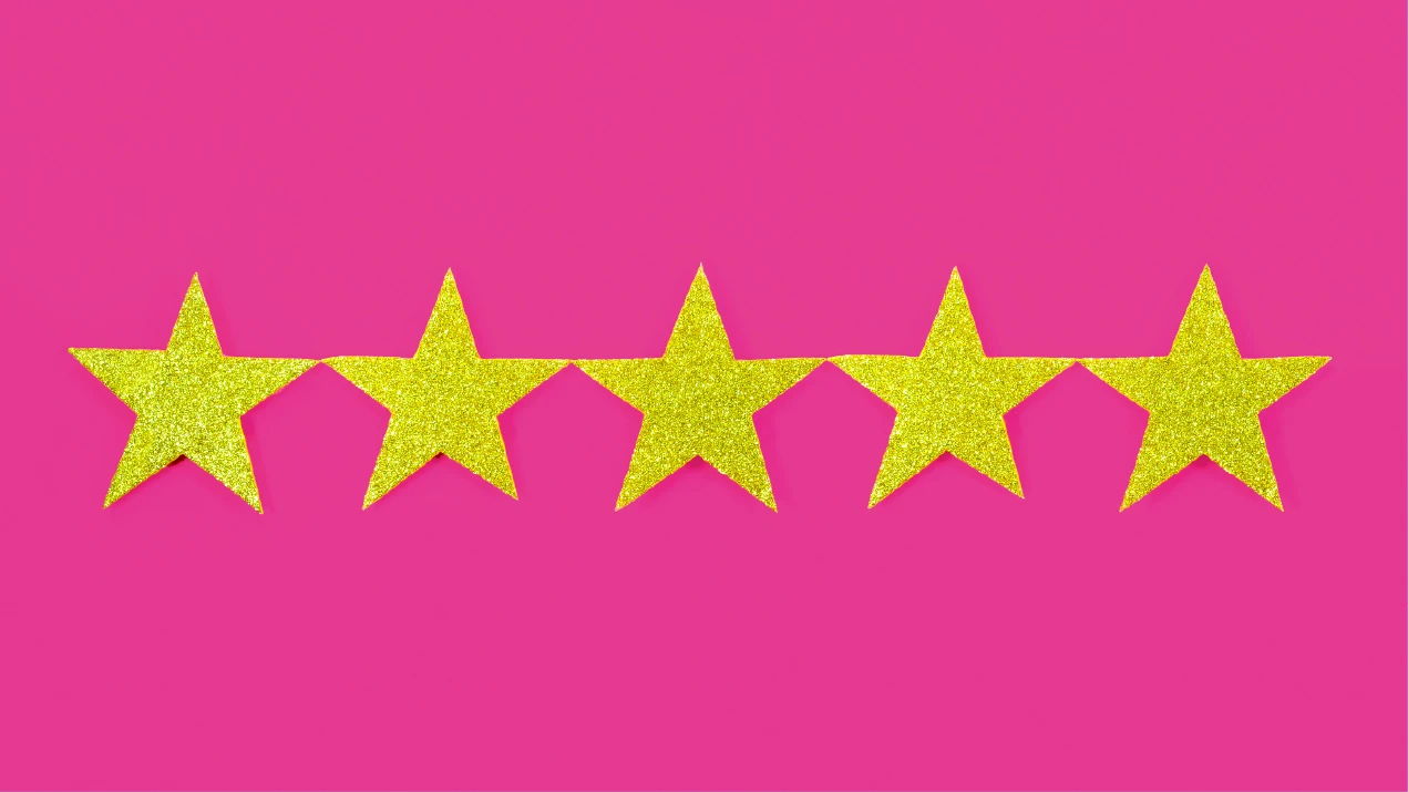 a row of stars on a pink background